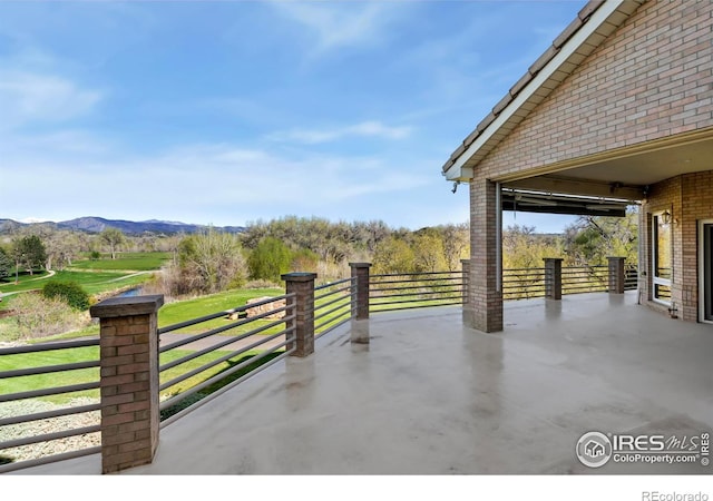 835 Rossum Dr, Loveland, CO 80537 - view of patio / terrace with a mountain view