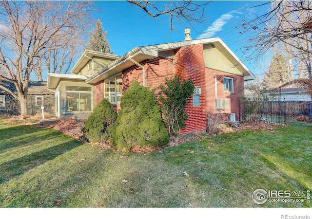 view of side of property featuring a lawn