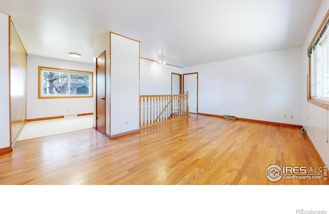 empty room featuring light hardwood / wood-style floors and a wealth of natural light