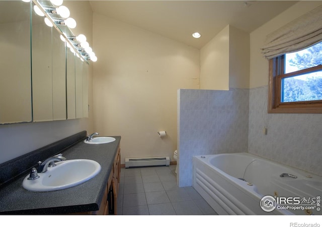 bathroom featuring vanity, a bathtub, a baseboard heating unit, tile patterned floors, and toilet