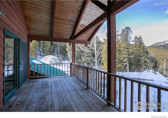 view of snow covered deck