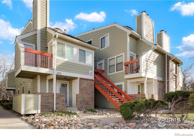 view of front of property with a balcony