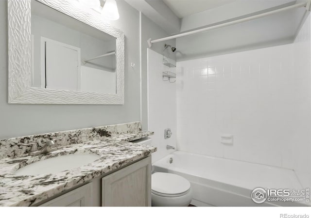 full bathroom featuring vanity, toilet, and tiled shower / bath