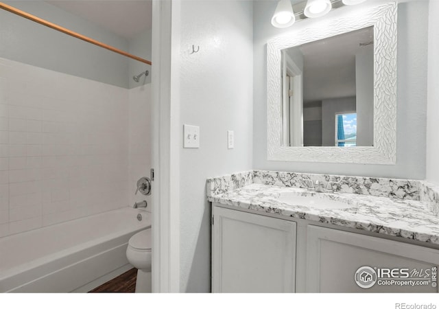 full bathroom featuring vanity, toilet, and shower / tub combination