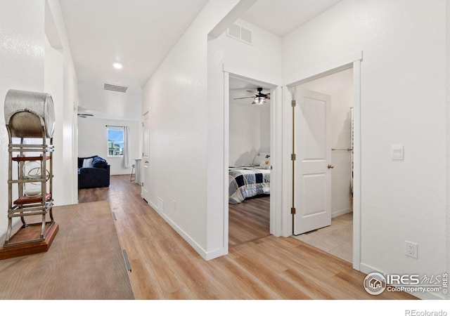 hall with light hardwood / wood-style floors