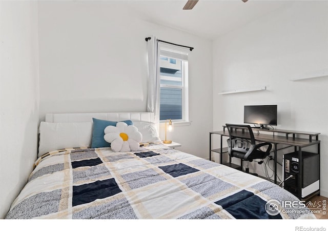 bedroom featuring ceiling fan and hardwood / wood-style flooring