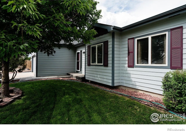 view of home's exterior featuring a lawn