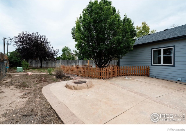 view of patio / terrace featuring an outdoor fire pit