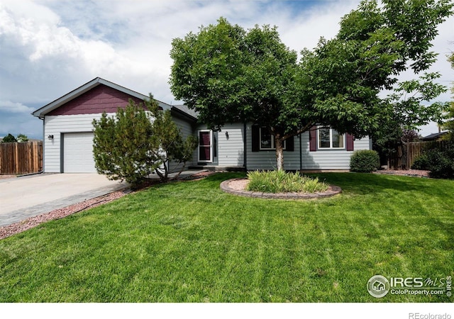 obstructed view of property featuring a front yard and a garage