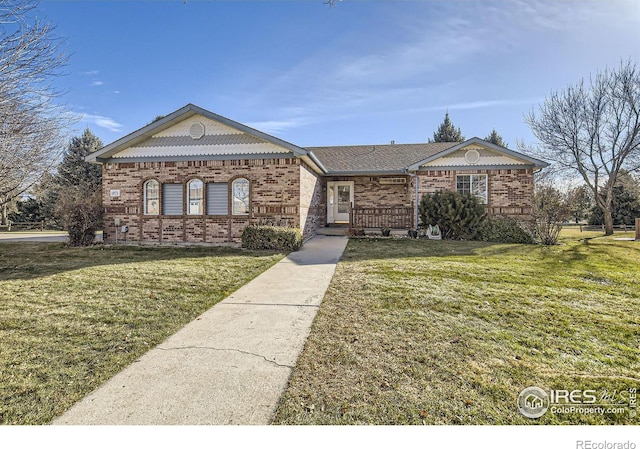 ranch-style house featuring a front lawn