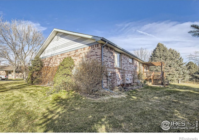 view of home's exterior with a yard