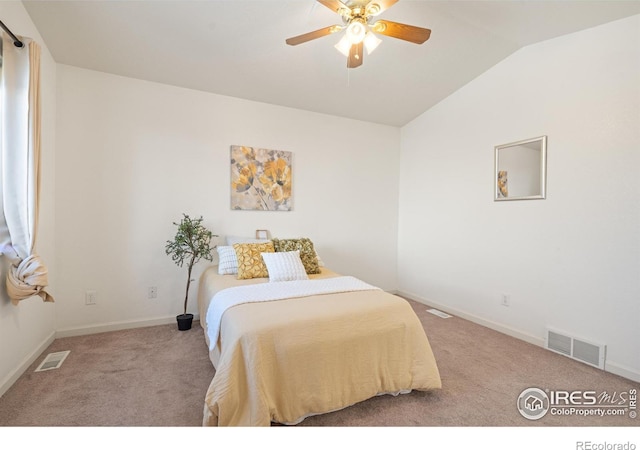 bedroom featuring vaulted ceiling, carpet floors, and ceiling fan