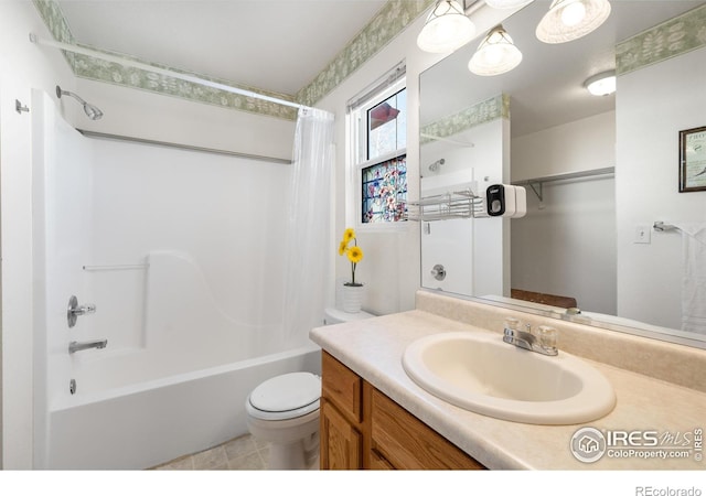 full bathroom featuring shower / tub combo, vanity, and toilet