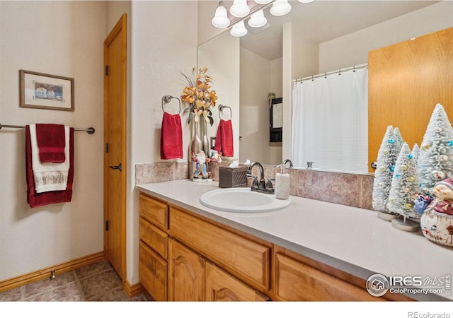 bathroom featuring tile patterned floors and vanity