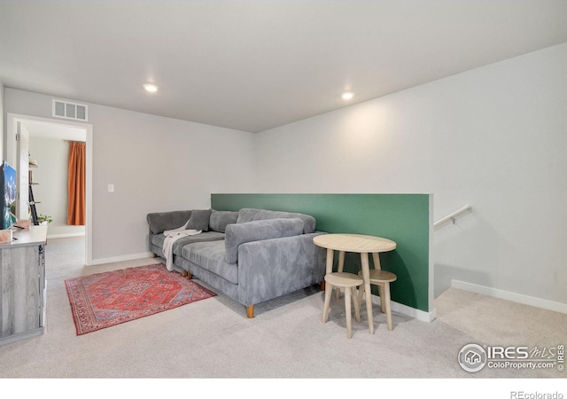 living room featuring light colored carpet