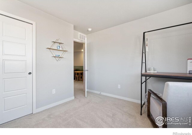 unfurnished office with light colored carpet