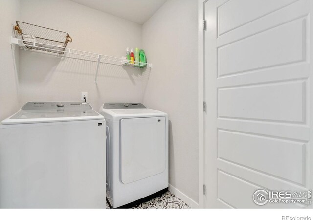 laundry room with washer and dryer