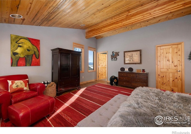 bedroom featuring lofted ceiling with beams and wooden ceiling