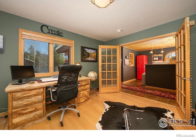 home office featuring hardwood / wood-style floors