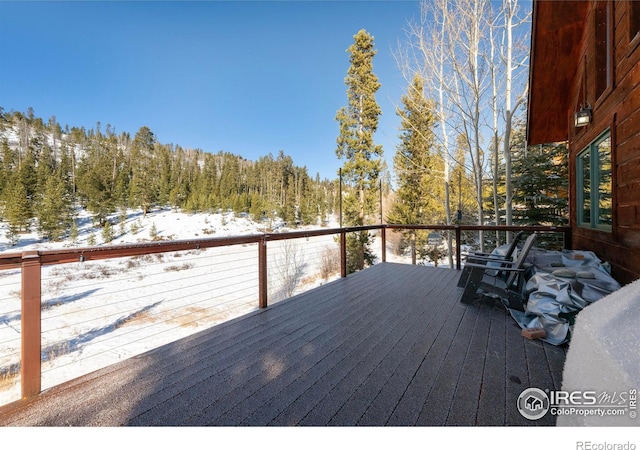 view of snow covered deck