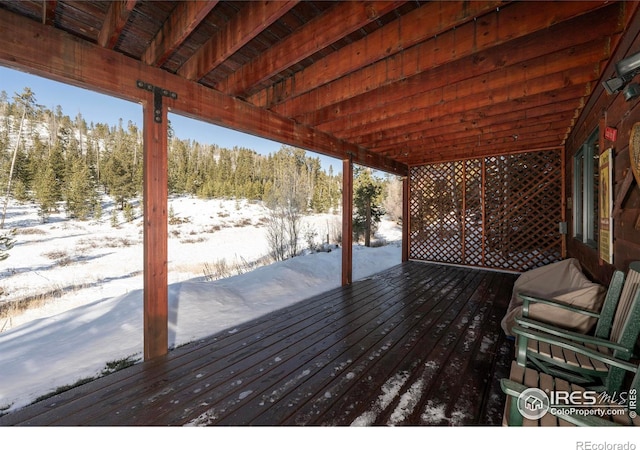 view of snow covered deck