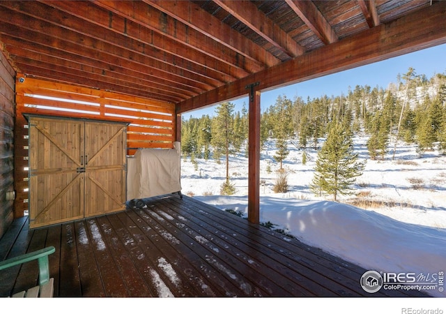 view of snow covered deck