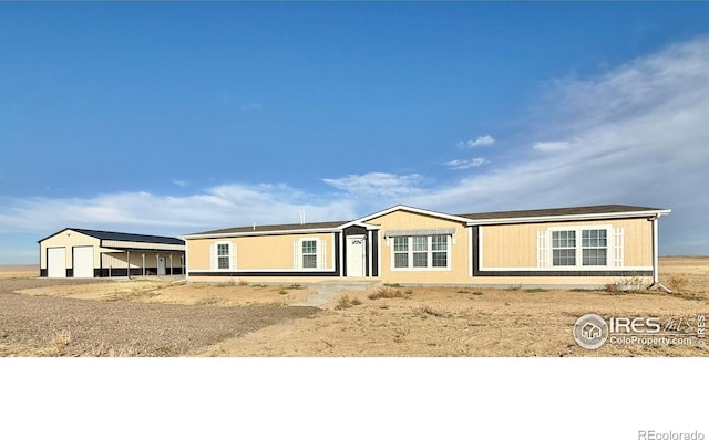 view of front of house featuring an outbuilding and a garage