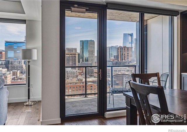 dining area featuring a wealth of natural light and dark hardwood / wood-style floors