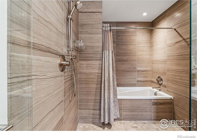 bathroom with tile patterned flooring and shower / bath combo with shower curtain