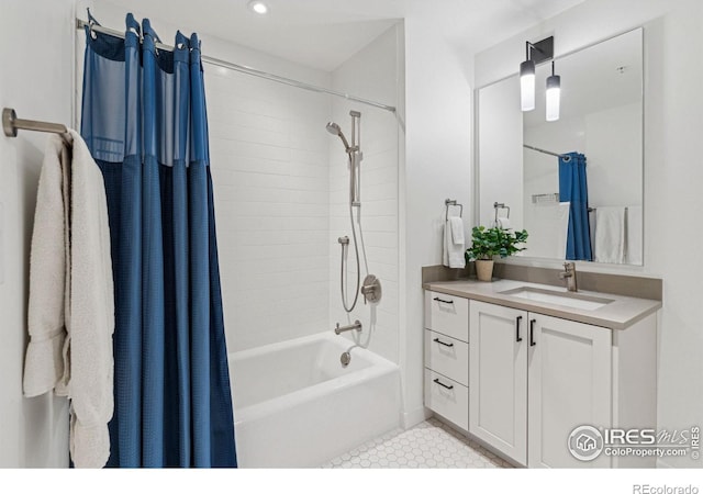 bathroom with tile patterned floors, vanity, and shower / bath combo with shower curtain