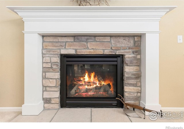 interior details featuring a fireplace and crown molding