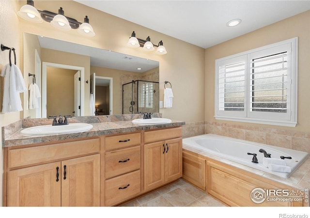 bathroom featuring separate shower and tub, tile patterned floors, and vanity