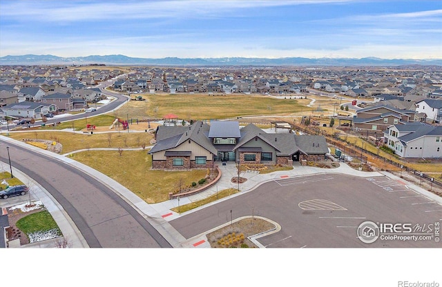 birds eye view of property featuring a mountain view