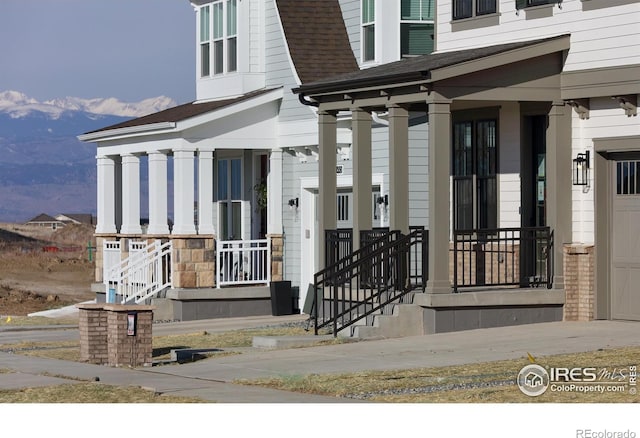 view of exterior entry with a porch