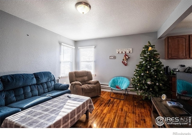 living room with dark hardwood / wood-style flooring, a textured ceiling, and a baseboard radiator