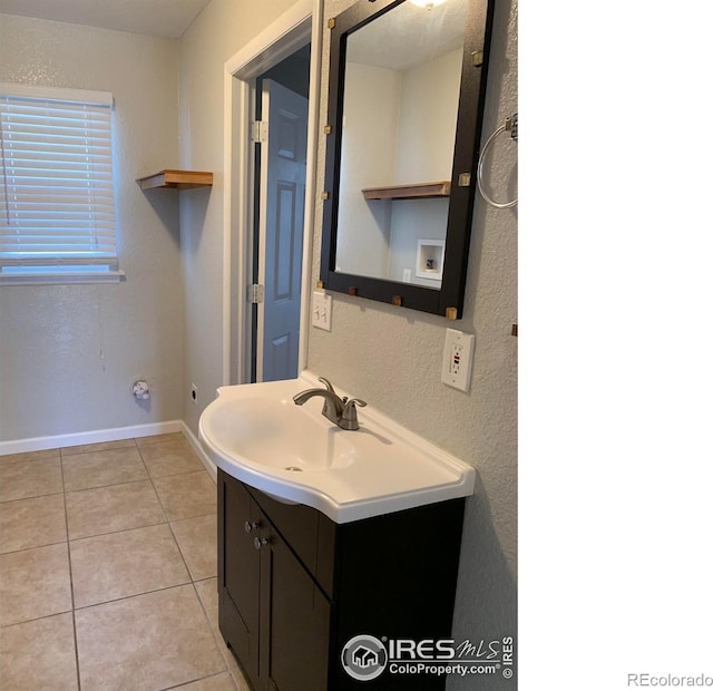 bathroom with vanity and tile patterned floors