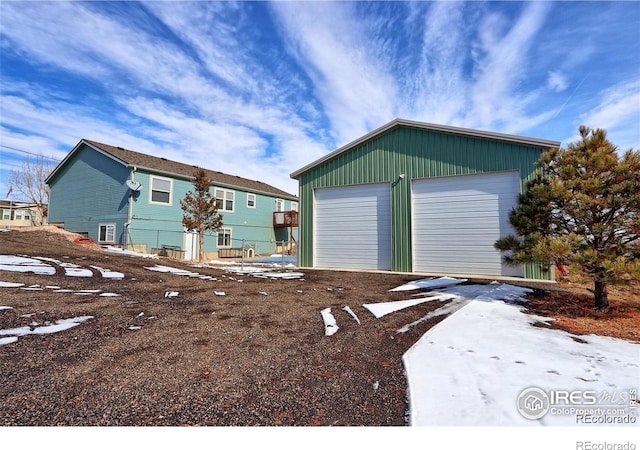 view of front of home featuring an outbuilding and a garage