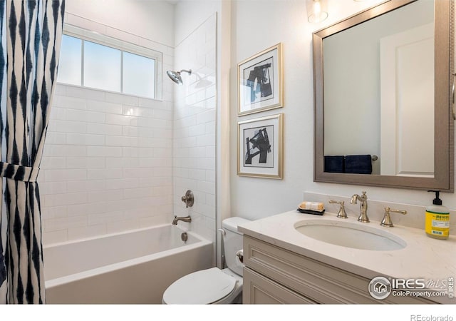 full bathroom with vanity, toilet, and shower / bath combo with shower curtain