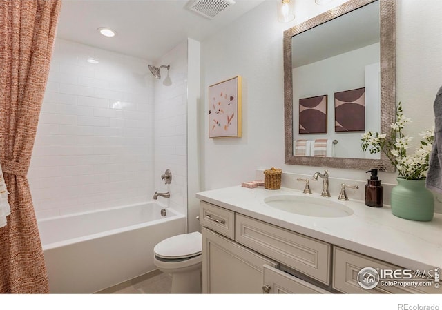 full bathroom featuring vanity, shower / tub combo with curtain, and toilet