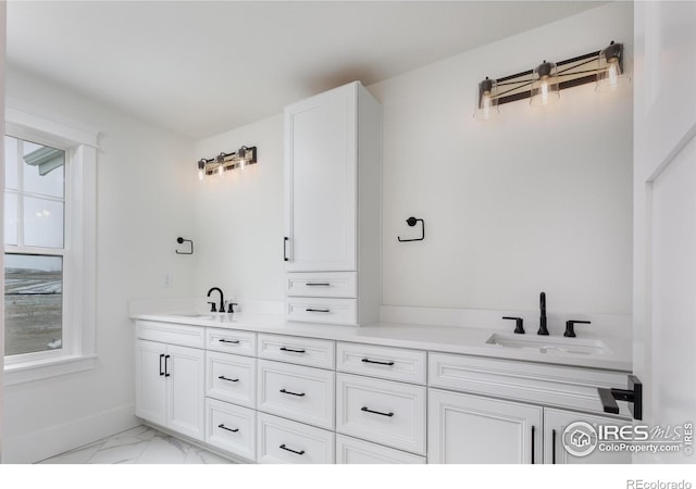 bathroom featuring plenty of natural light and vanity