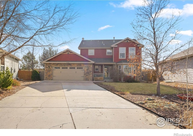 view of front of property featuring a front yard and a garage