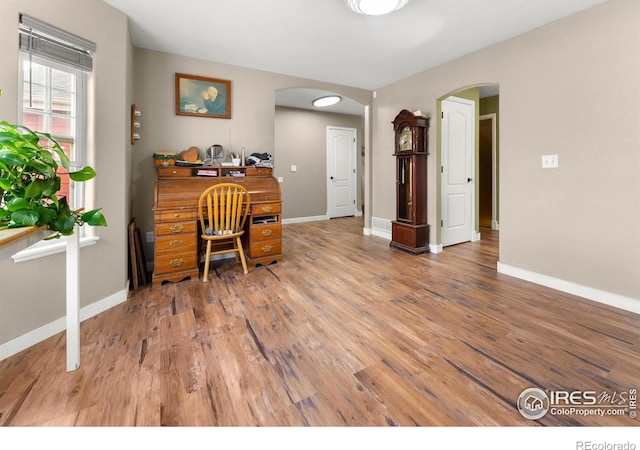 office area with wood-type flooring