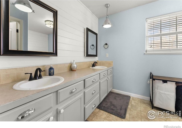 bathroom featuring decorative backsplash and vanity