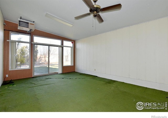 carpeted empty room featuring ceiling fan and lofted ceiling