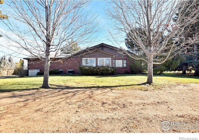 view of home's exterior with a lawn