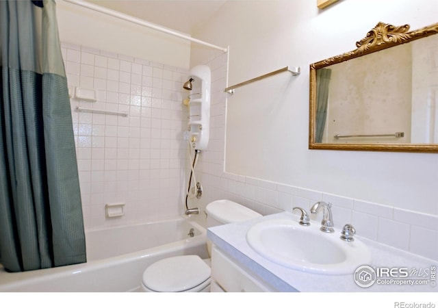 full bathroom with vanity, shower / bathtub combination with curtain, and toilet