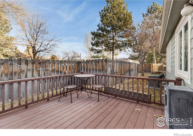 wooden terrace featuring central air condition unit