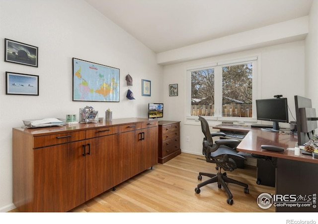 office featuring light hardwood / wood-style flooring and vaulted ceiling