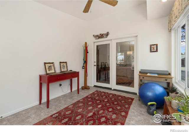 interior space featuring french doors and ceiling fan