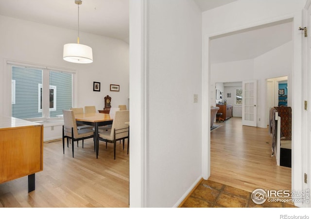 dining area featuring light hardwood / wood-style floors and french doors